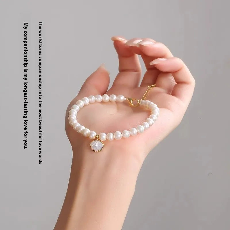 Real natural 5-6mm freshwater pearl bracelet with fan shape design and alloy details on 16cm band