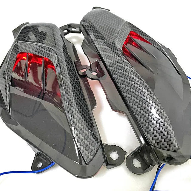 Yamaha NMAX LED side lamp replacement kit with carbon fibre decoration showing ABS plastic construction