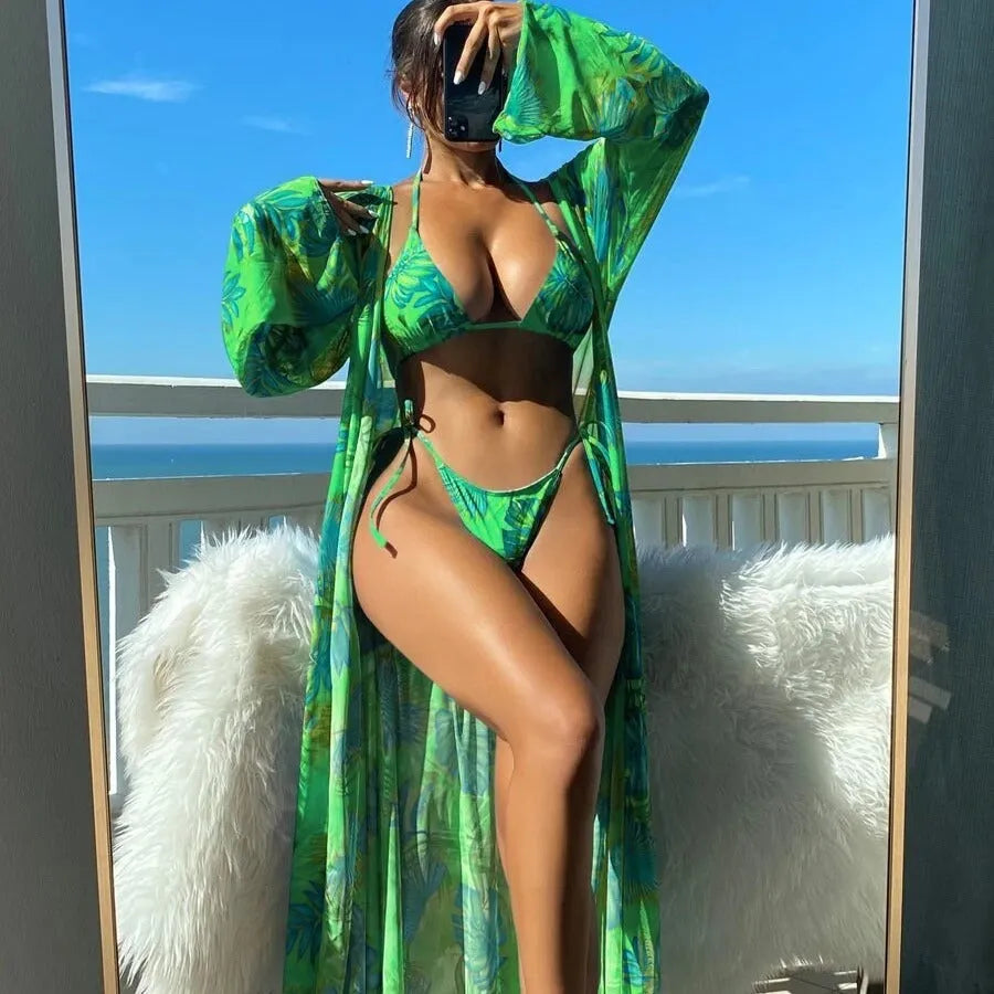 Split long sleeve blouse and banded bikini set with matching outer robe in polyester fabric