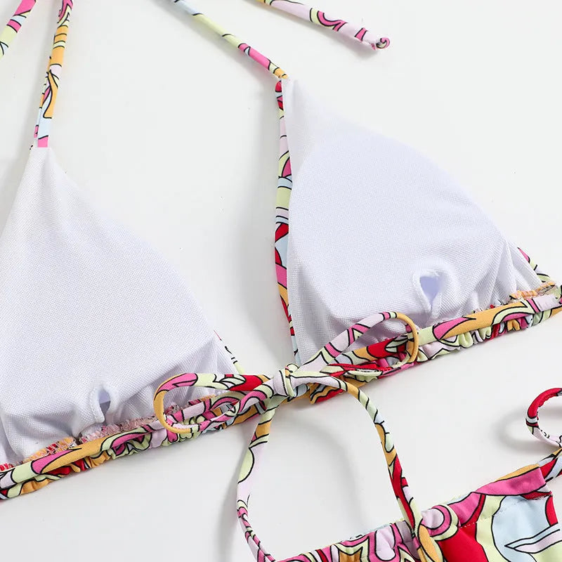 Women's multicolour printed triangle bikini top with hanging neck and matching briefs.