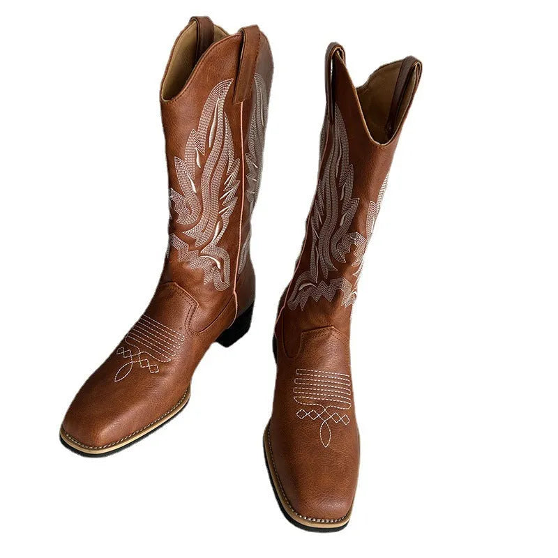 Brown women's mid-calf lace-up Martin boots with embroidered pattern on the upper.