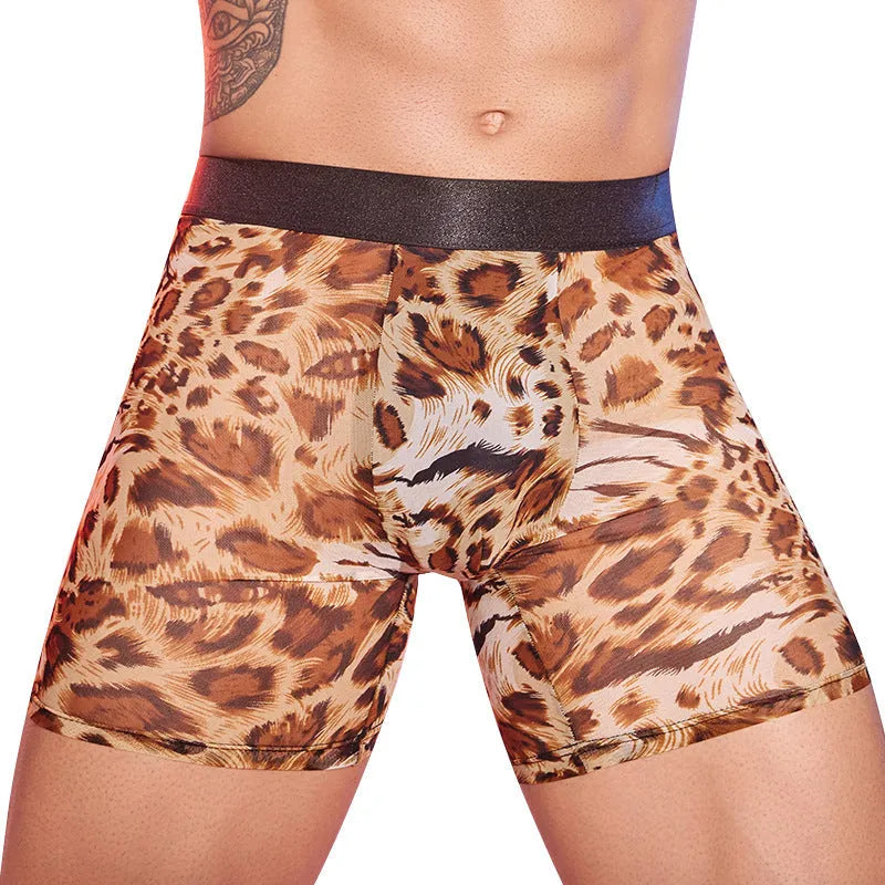 Men's leopard print nylon boxer shorts laid flat, showing the bold animal pattern and elastic waistband.