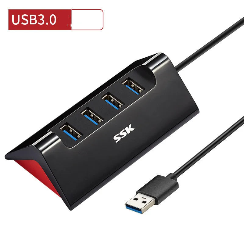 Black USB expansion dock with four ports measuring 100mm by 50mm