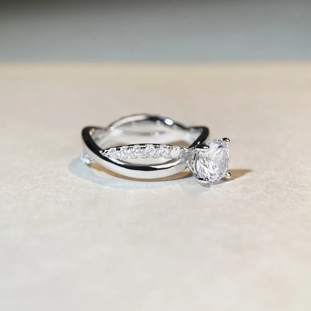 Silver twisted arm ring with a 1 karat moissanite stone in a four-claw setting.