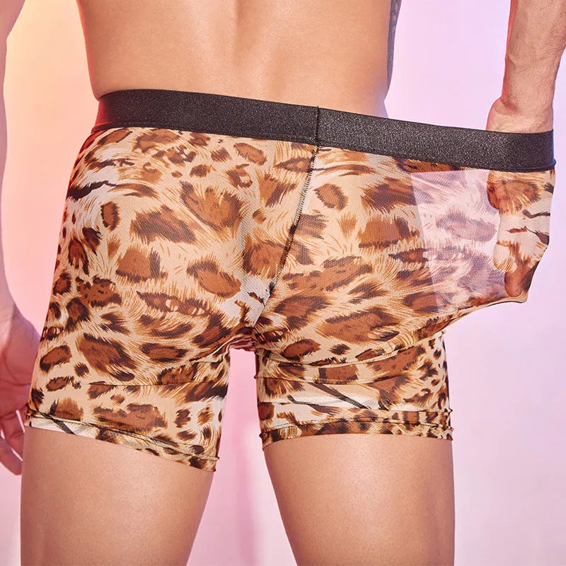 Men's leopard print nylon boxer shorts laid flat, showing the bold animal pattern and elastic waistband.