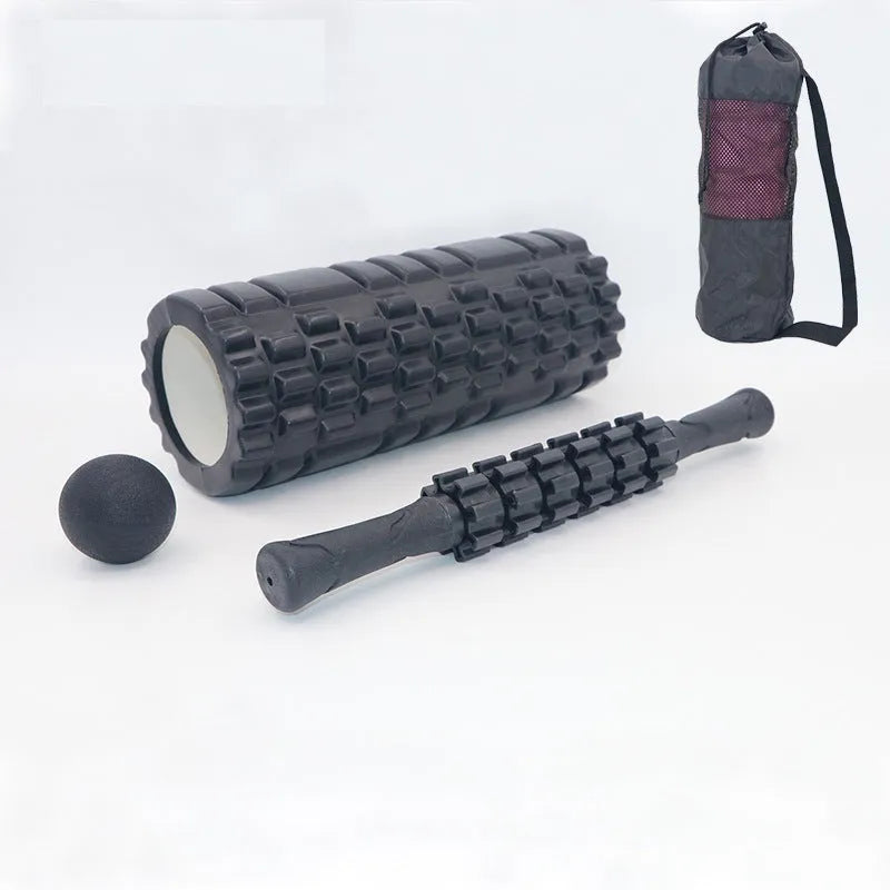 Black foam massage roller stick with six gear segments, 33cm long.