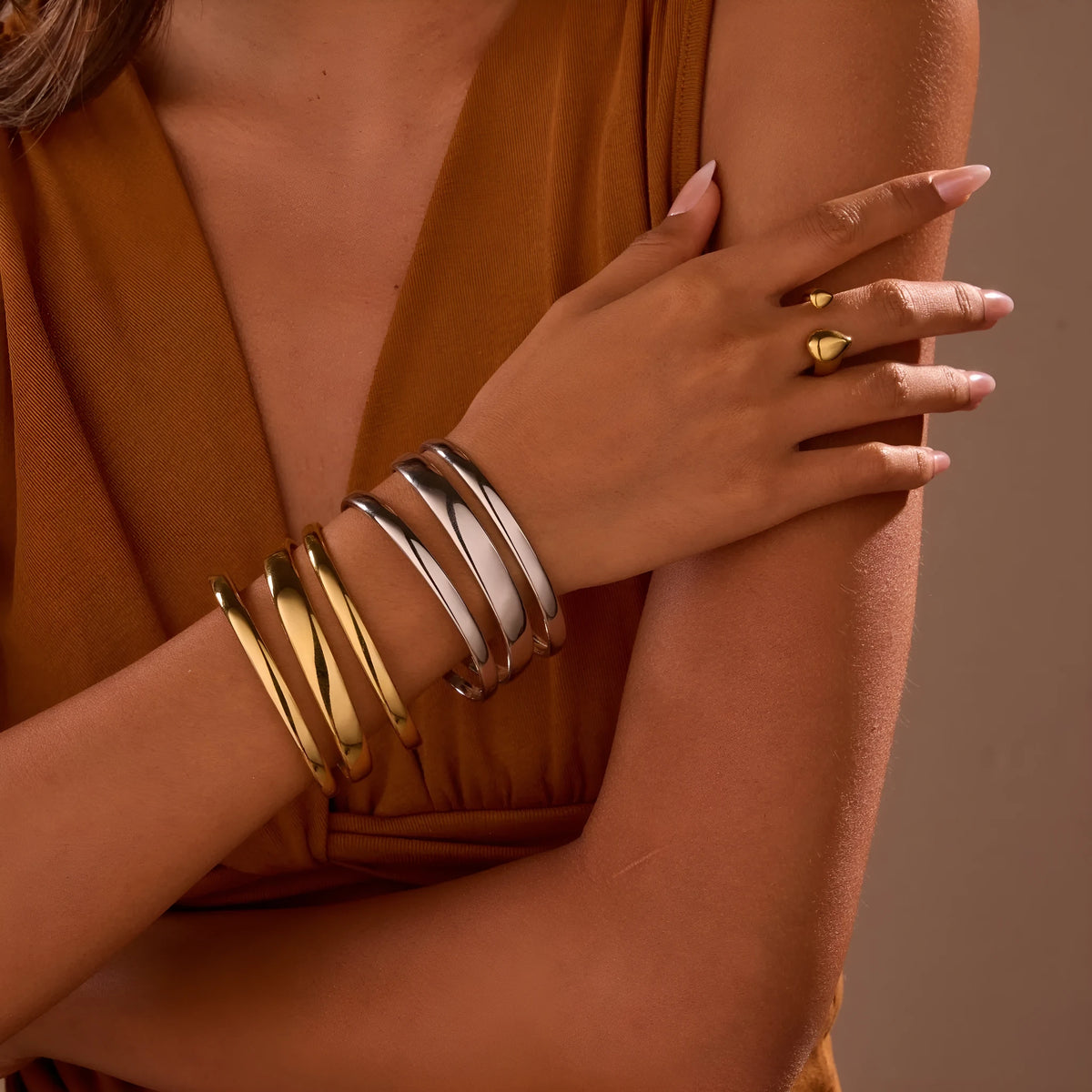 Stainless steel geometric open bracelet for women in gold or silver electroplated finish.
