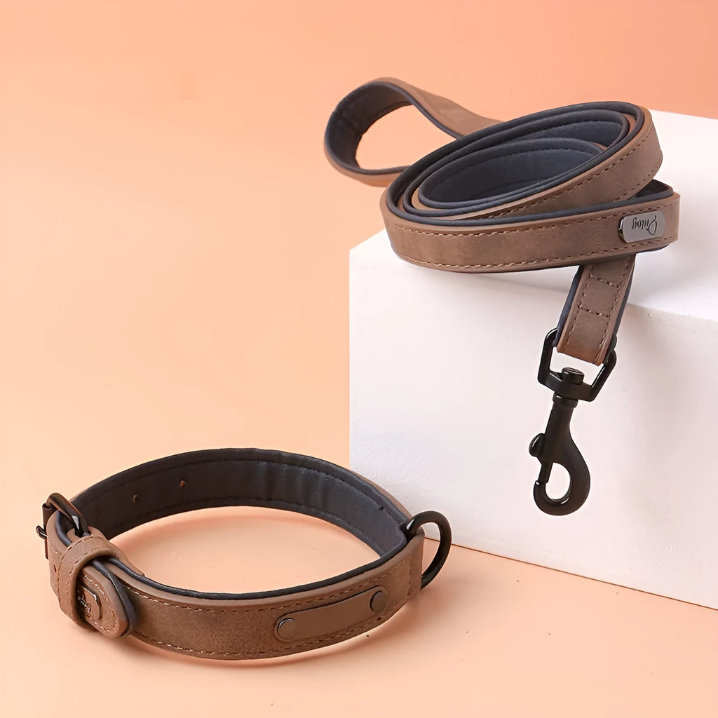 Adjustable double-layer dog collar in purple, showing PU front and microfiber back, with a buckle.