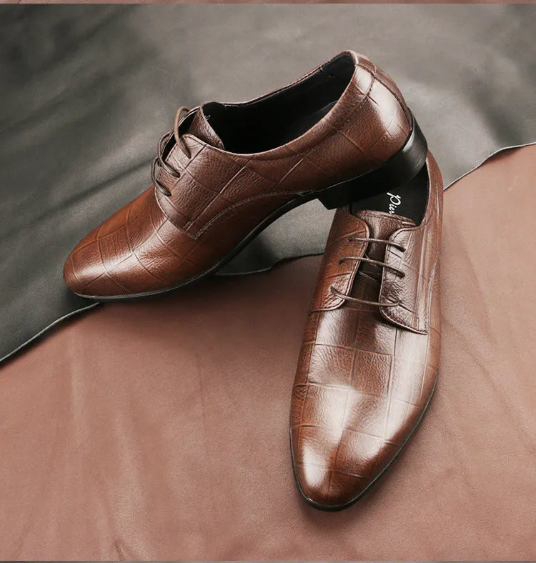 Men's black handmade cow leather derby shoes with pointed toe and checkered sewing pattern on a rubber sole.
