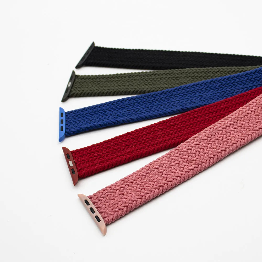 Nylon Apple Watch strap with plastic head connector in army green, showing elastic woven texture.