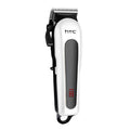 Red rechargeable hair clipper with four attachment combs, a charger, and grooming accessories on a white background.