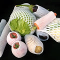 White foam net sleeve for protecting apples pears peaches and citrus fruit from bruising