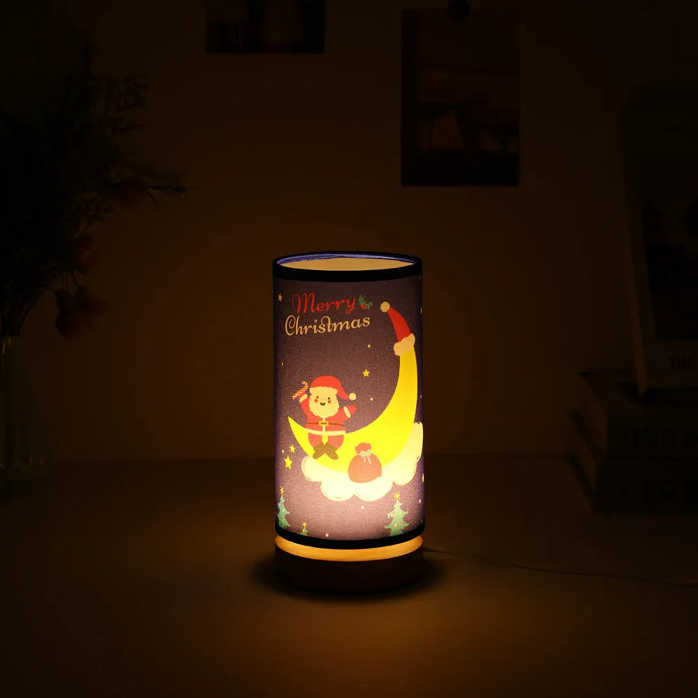 Moon-shaped Santa Claus LED night light with USB plug on bamboo base.