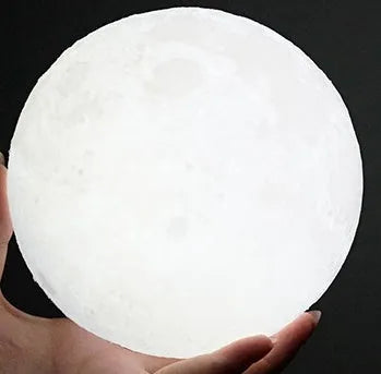3D printed moon lamp on wooden stand showing touch ring and detailed lunar surface