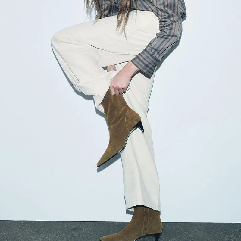 Women's brown square toe mid-calf boots with side zipper and retro kitten heel on wooden floor