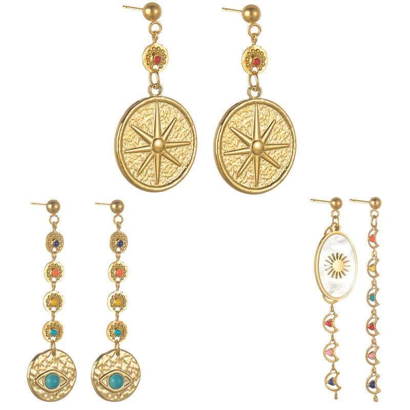 Geometric stainless steel earrings showing eight awn star, eye pattern, and shell sun designs