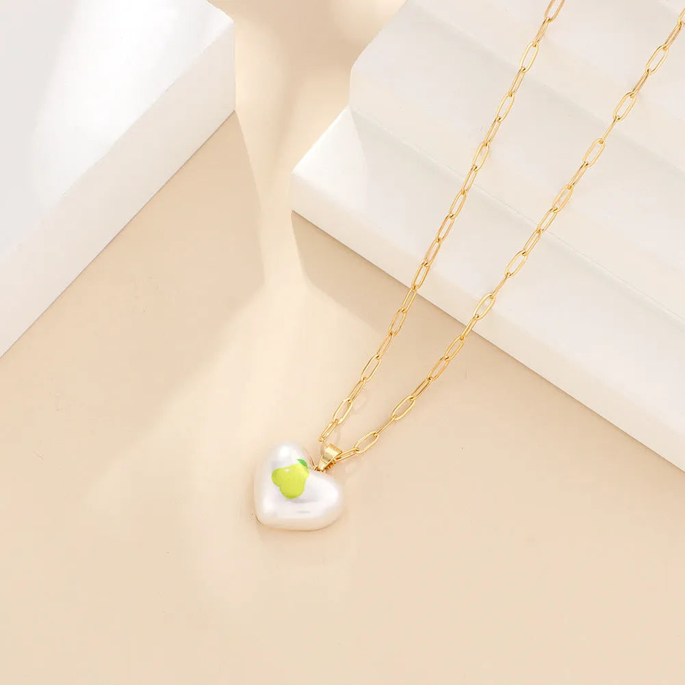 Geometric heart necklace with fruit pendant on adjustable chain in apple cherry pear pineapple strawberry designs