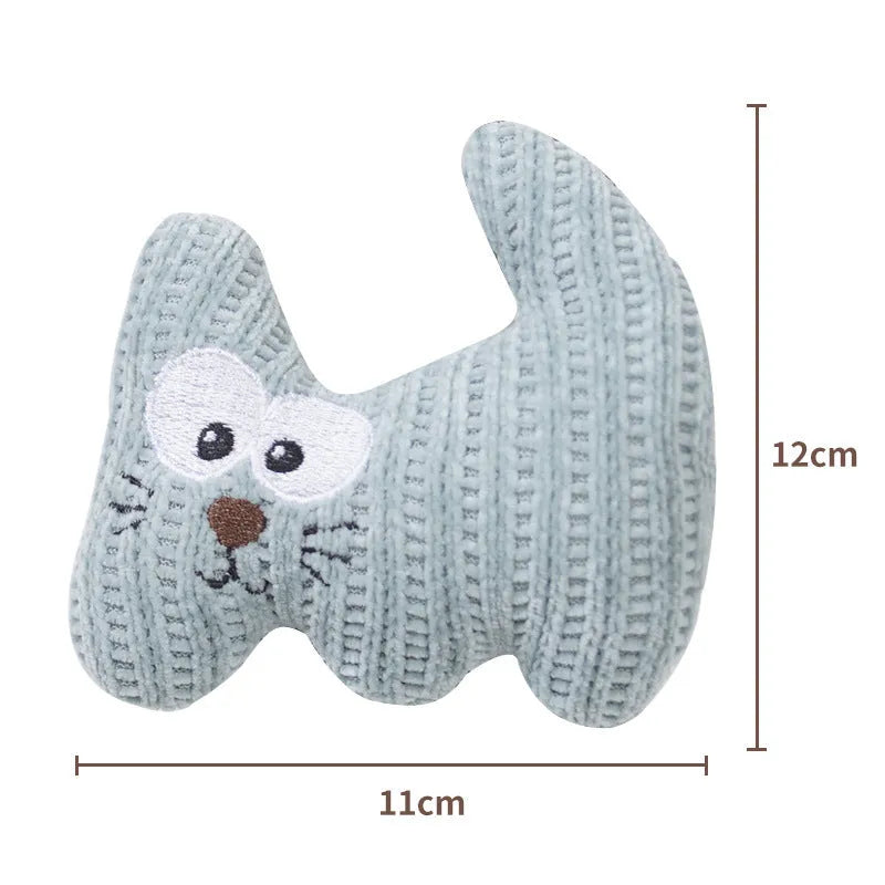 Cyan and light coffee coloured knitted plush cat toy with bell and catnip, shown next to a ruler showing 12cm length.