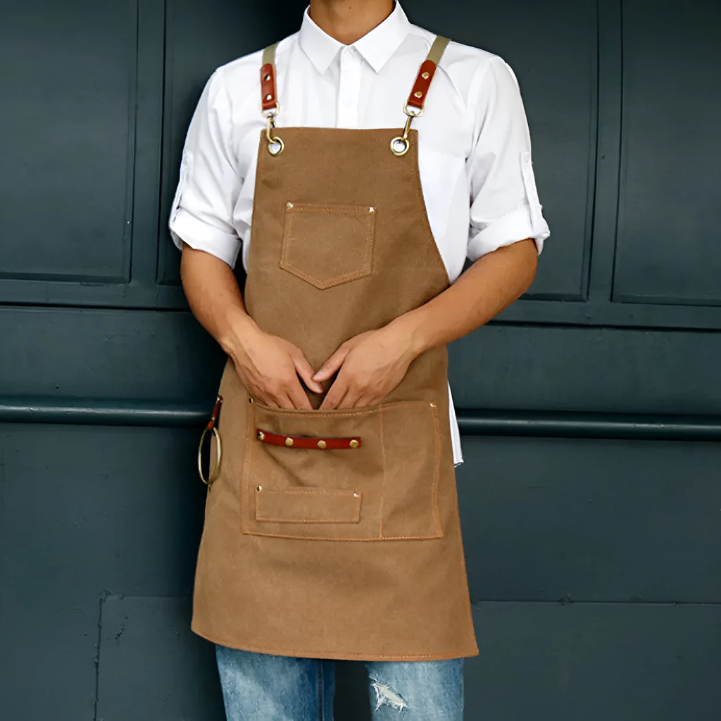 Canvas cross-strap apron in camel colour for cafe or baking work