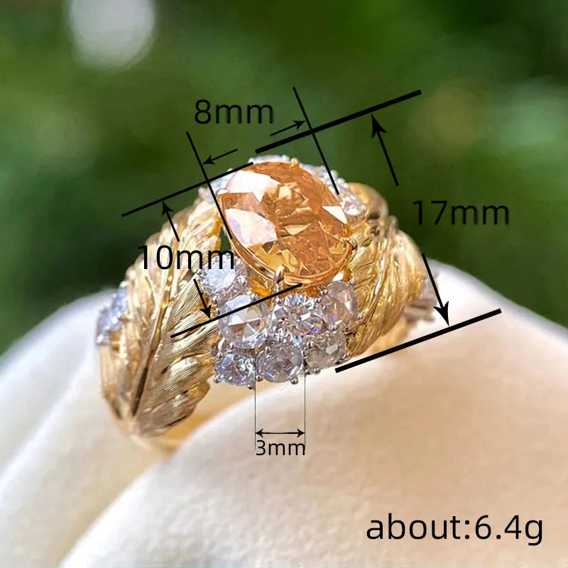 Gold colour copper feather ring with geometric embossing and yellow zircon stone centre