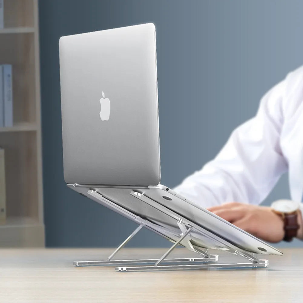 Silver aluminium laptop stand in folded and unfolded positions next to a 15-inch laptop.