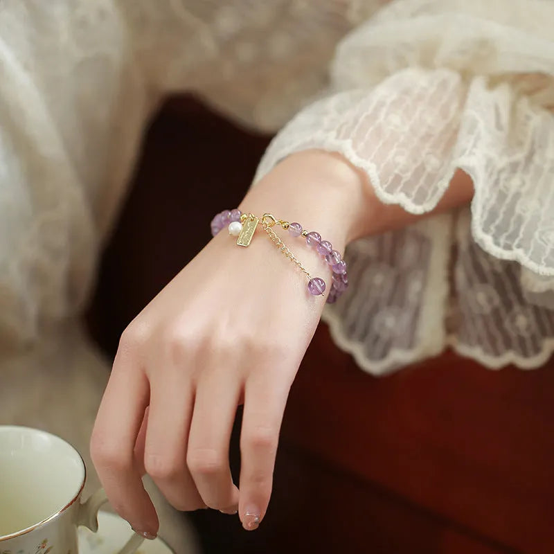 Women's natural crystal amethyst bracelet in romantic lavender colour with zodiac modelling design