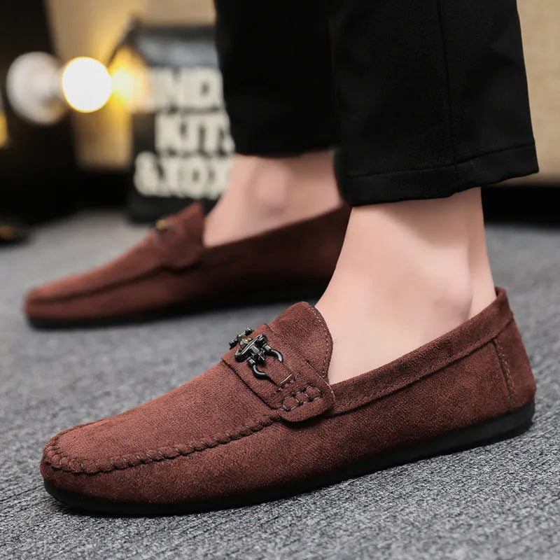 Men's waterproof black and brown slip-on loafers with round toe and low stiletto heel on a rubber sole.