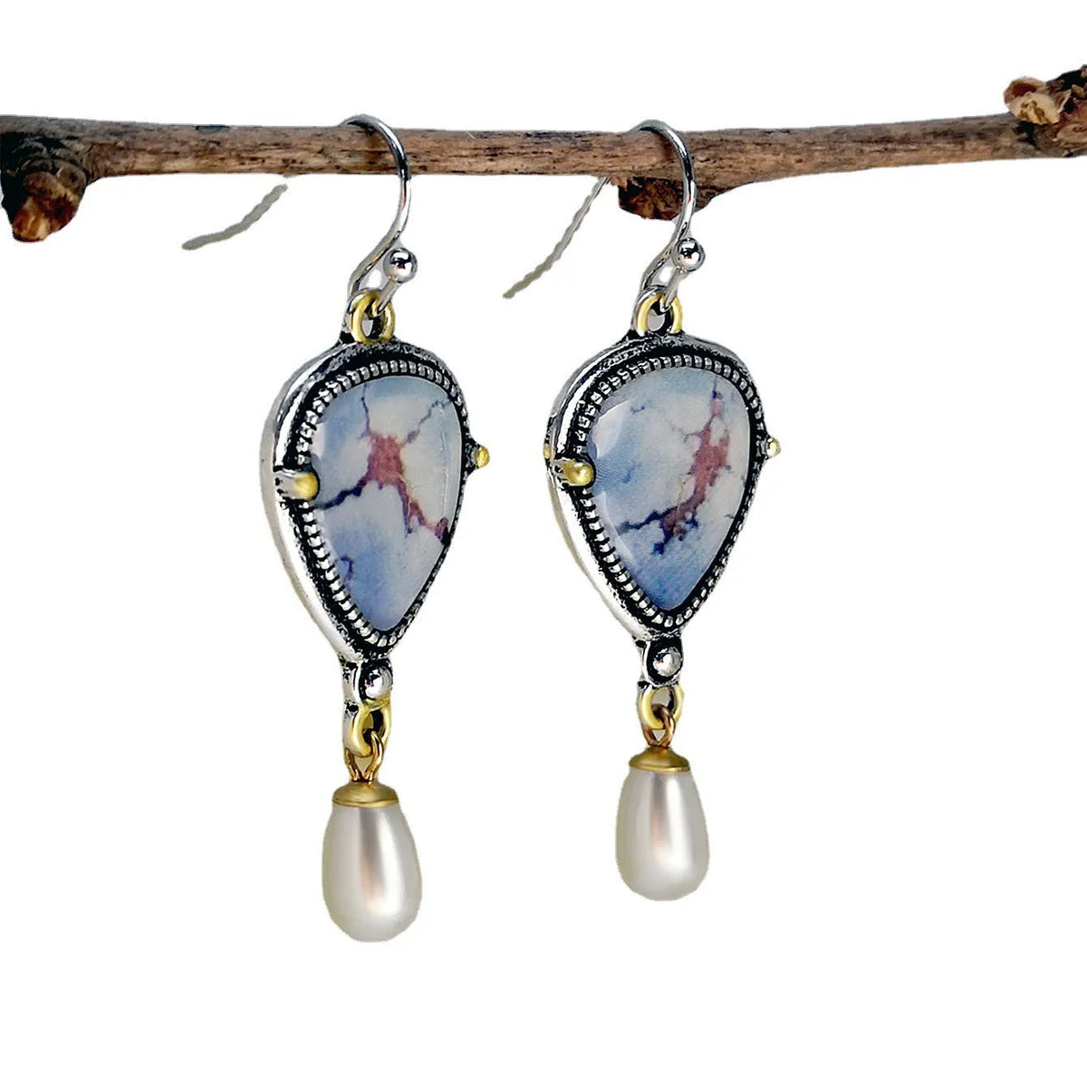Retro blue bohemian drop earrings with lavender turquoise and pearl elements on geometric metal setting