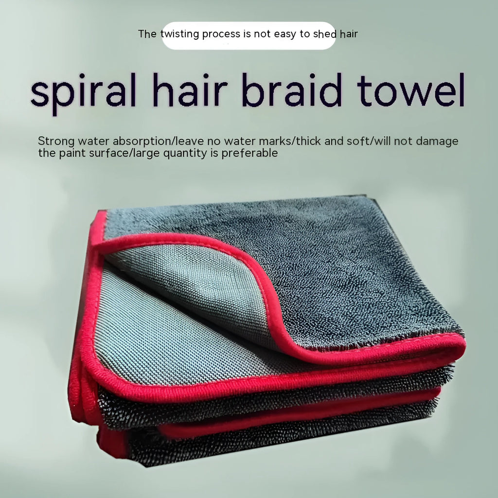 Grey car cleaning towel with black edge trim showing hemmed sides and spiral hair texture.