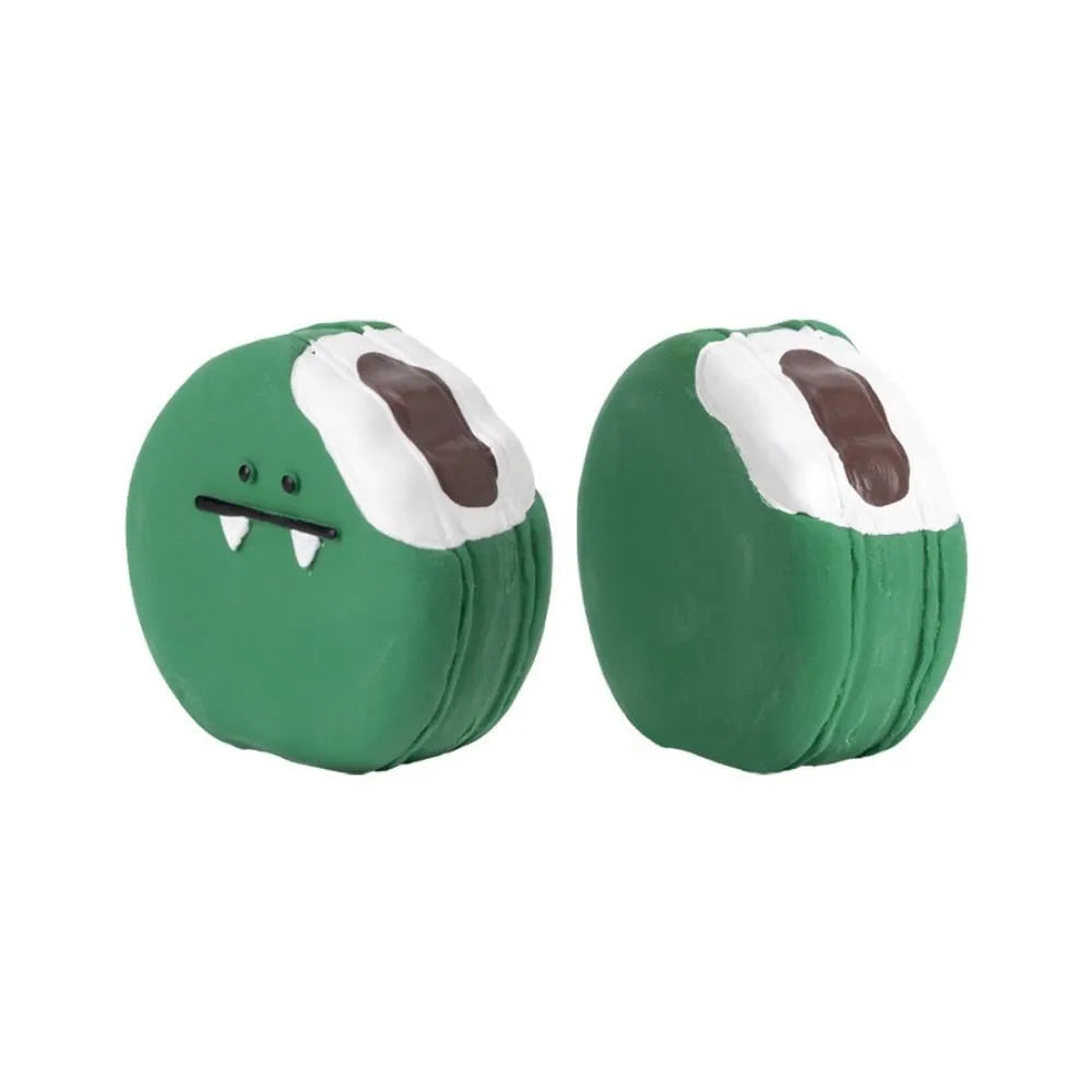 Yellow and green cartoon egg bread shaped latex squeaky toy for dogs on a white background.
