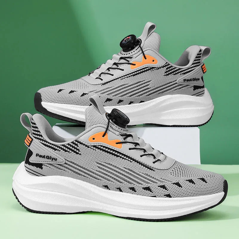 Men's white and green running shoes with rotating buckle and mesh upper on a flat TPU sole.