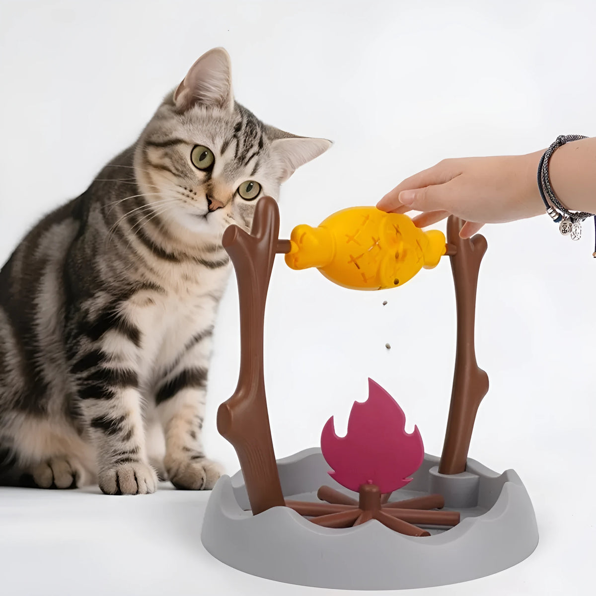 Barbecue grill style tumbling cat feeder toy with food dispensing mechanism 30cm dimensions