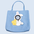 Little Bee Design canvas pet carrier shoulder bag in blue with animal pattern and adjustable side opening.