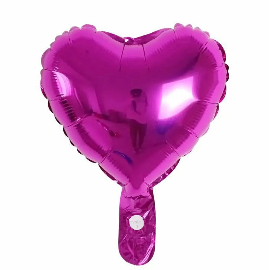 Five peach heart shaped aluminum balloons in red, blue, rose, and silver floating in mixed 10 and 5 inch sizes