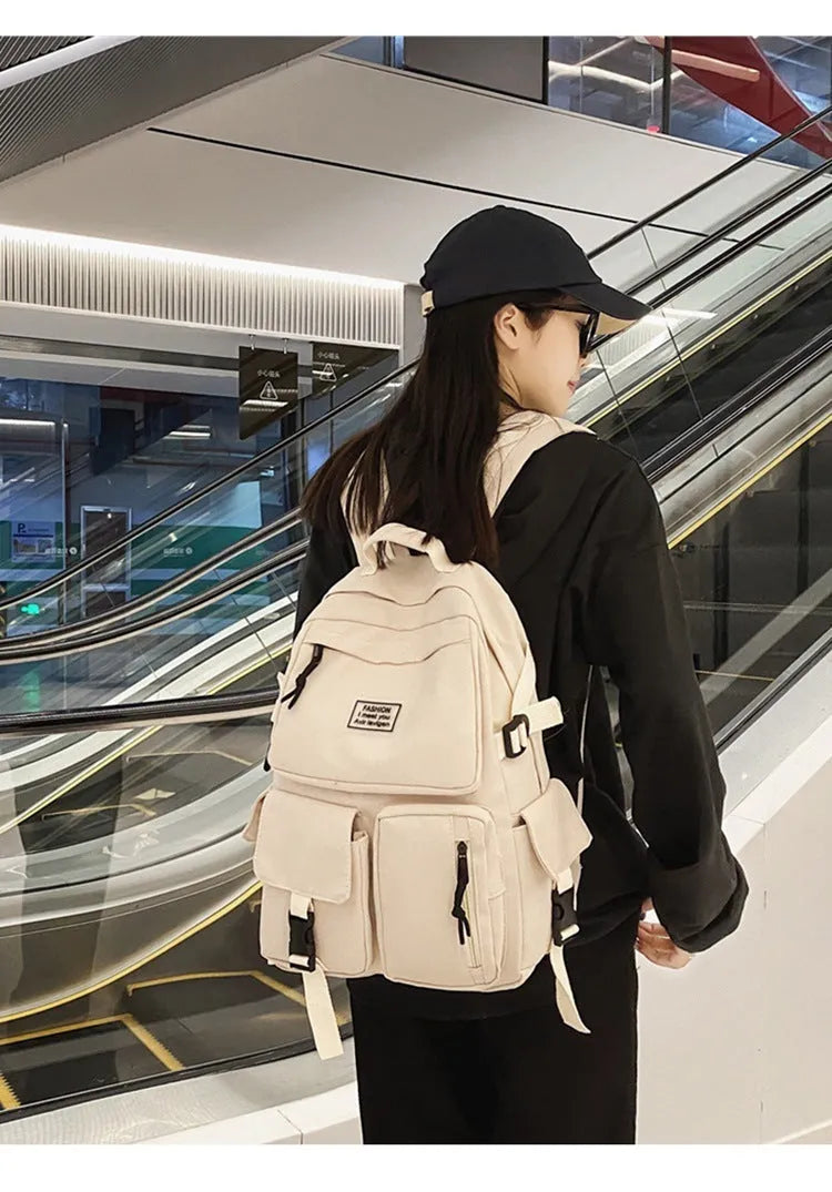 Black and white nylon student backpack with laptop compartment and external pockets