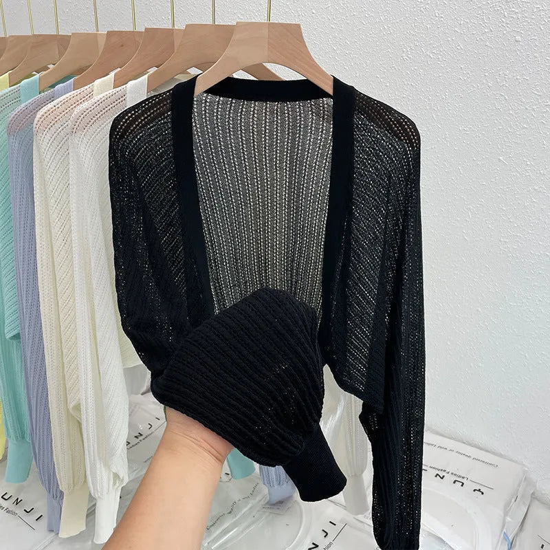 Women's hollow out blouse with long lantern sleeves in a linen blend fabric, shown in apricot colour.