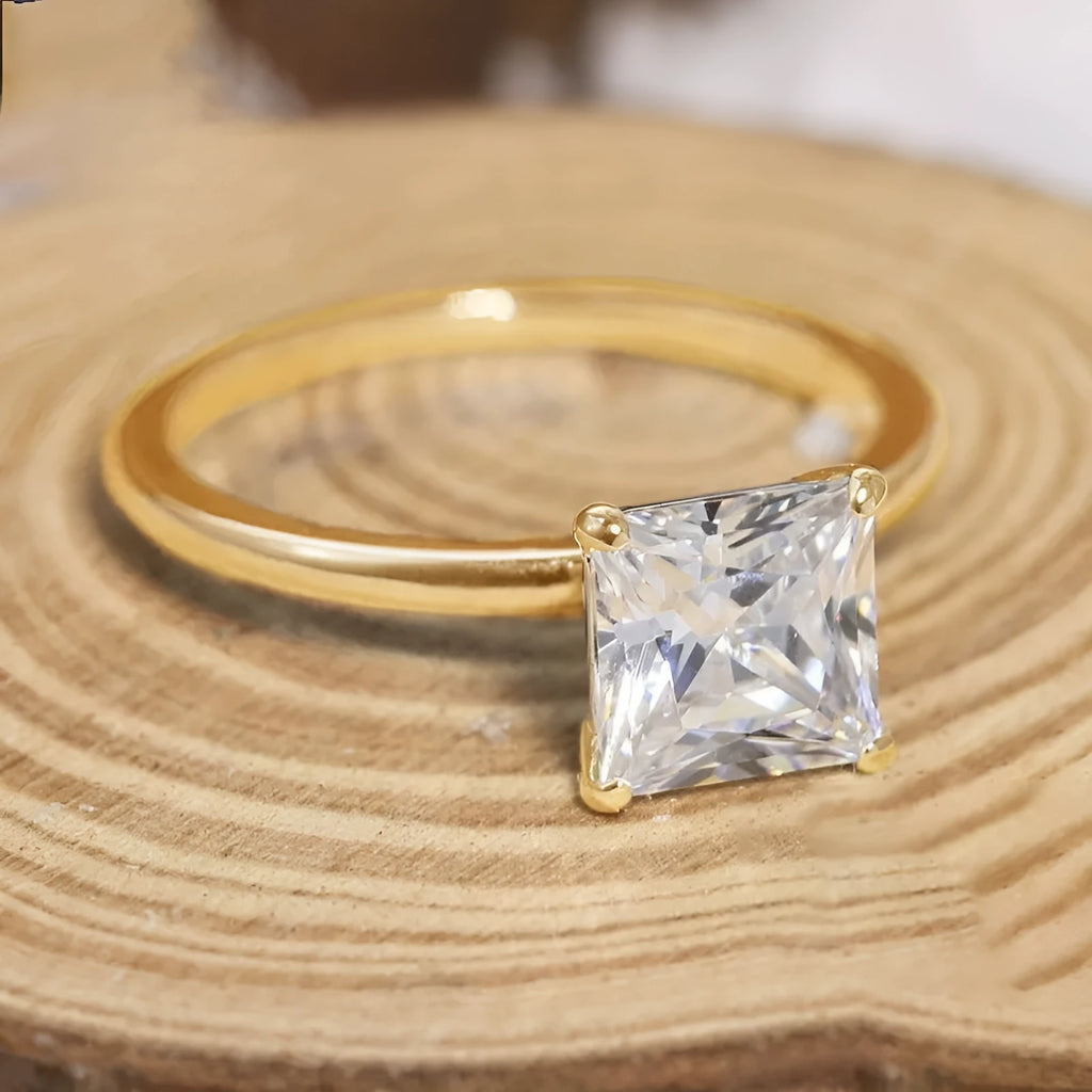 Geometric 925 sterling silver women's ring with round zirconia stone in silver, gold, and rose gold finishes.