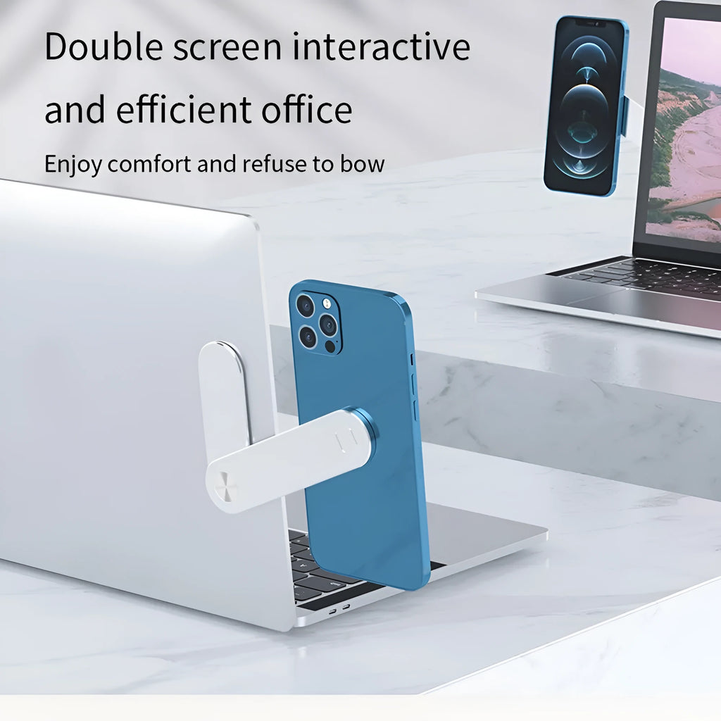 Black adjustable magnetic phone holder clipped to silver laptop showing phone mounted beside screen