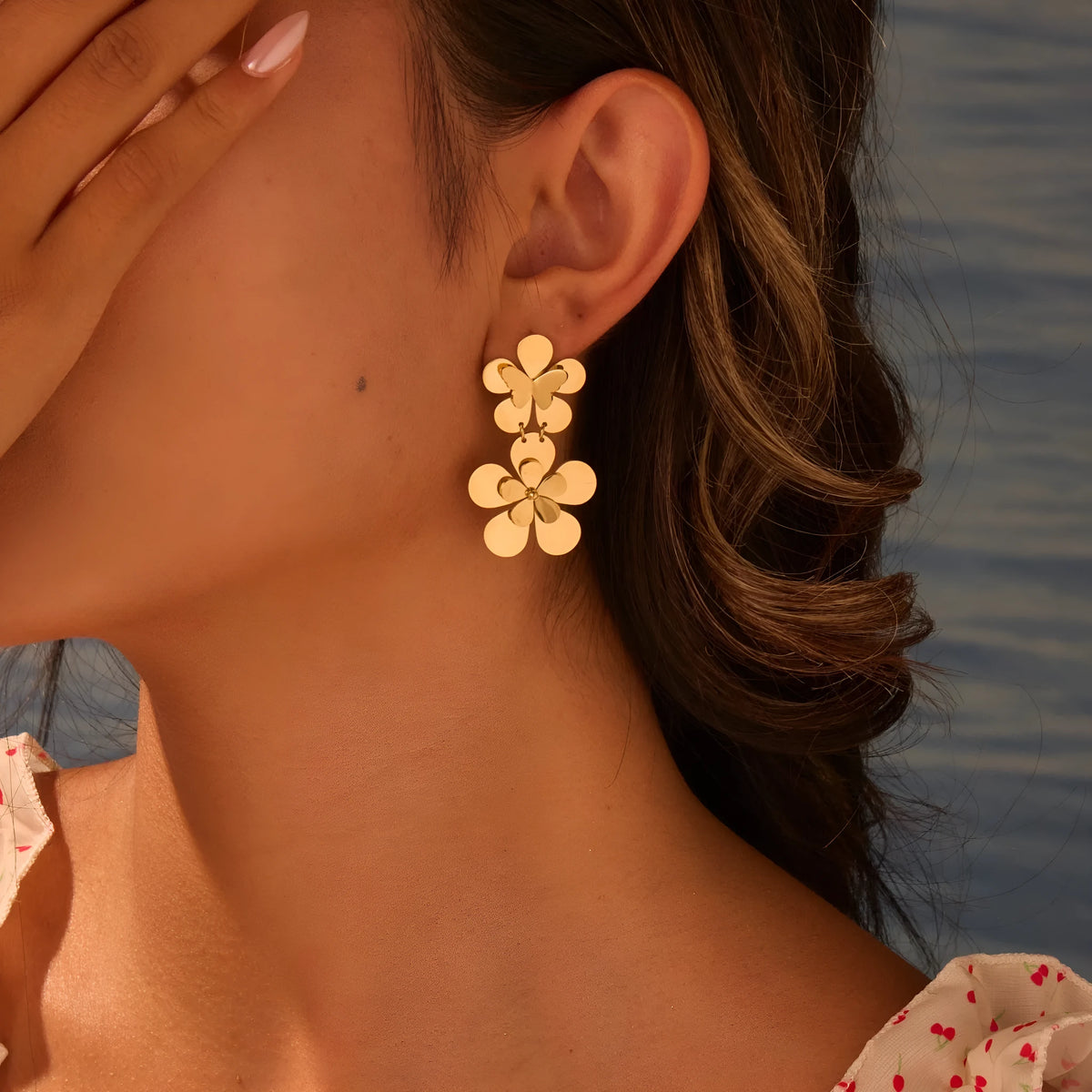 Gold electroplated stainless steel women's earrings with floral butterfly design