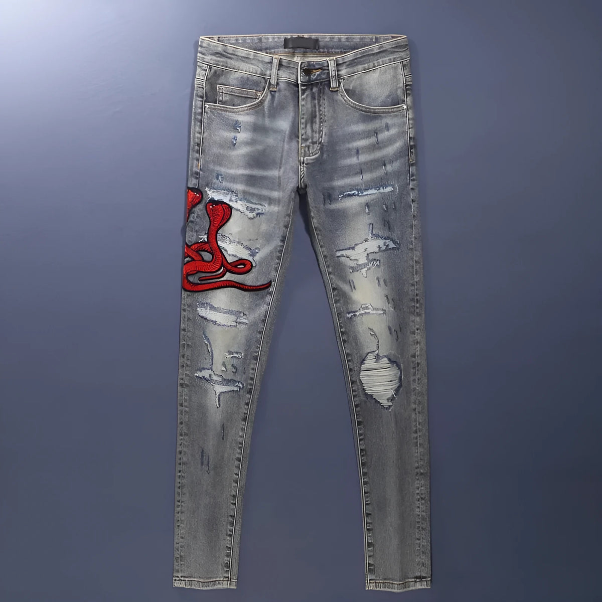 Old colour slim fit jeans with hole patches and embroidered detailing on worn cotton fabric