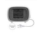 Mini portable electric heater in green colour with compact rectangular design for desk or bedside use