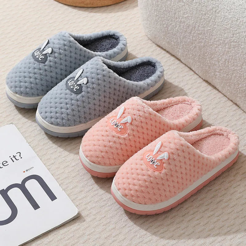 Women's rabbit plaid artificial fur slippers with a thick rubber sole in apricot colour.