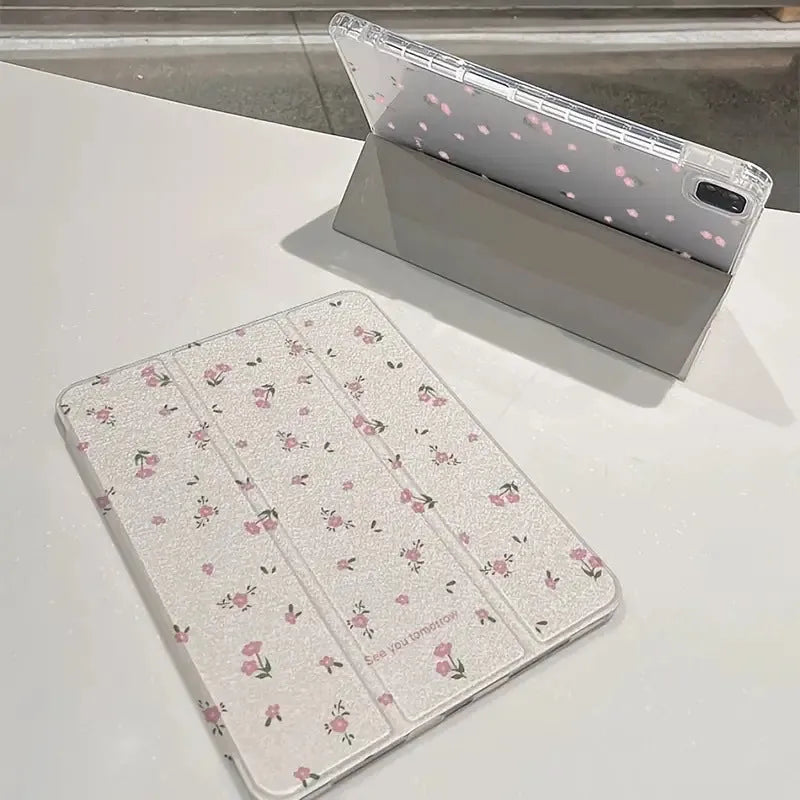 Transparent floral tri-fold iPad protective case showing magnetic stand function.
