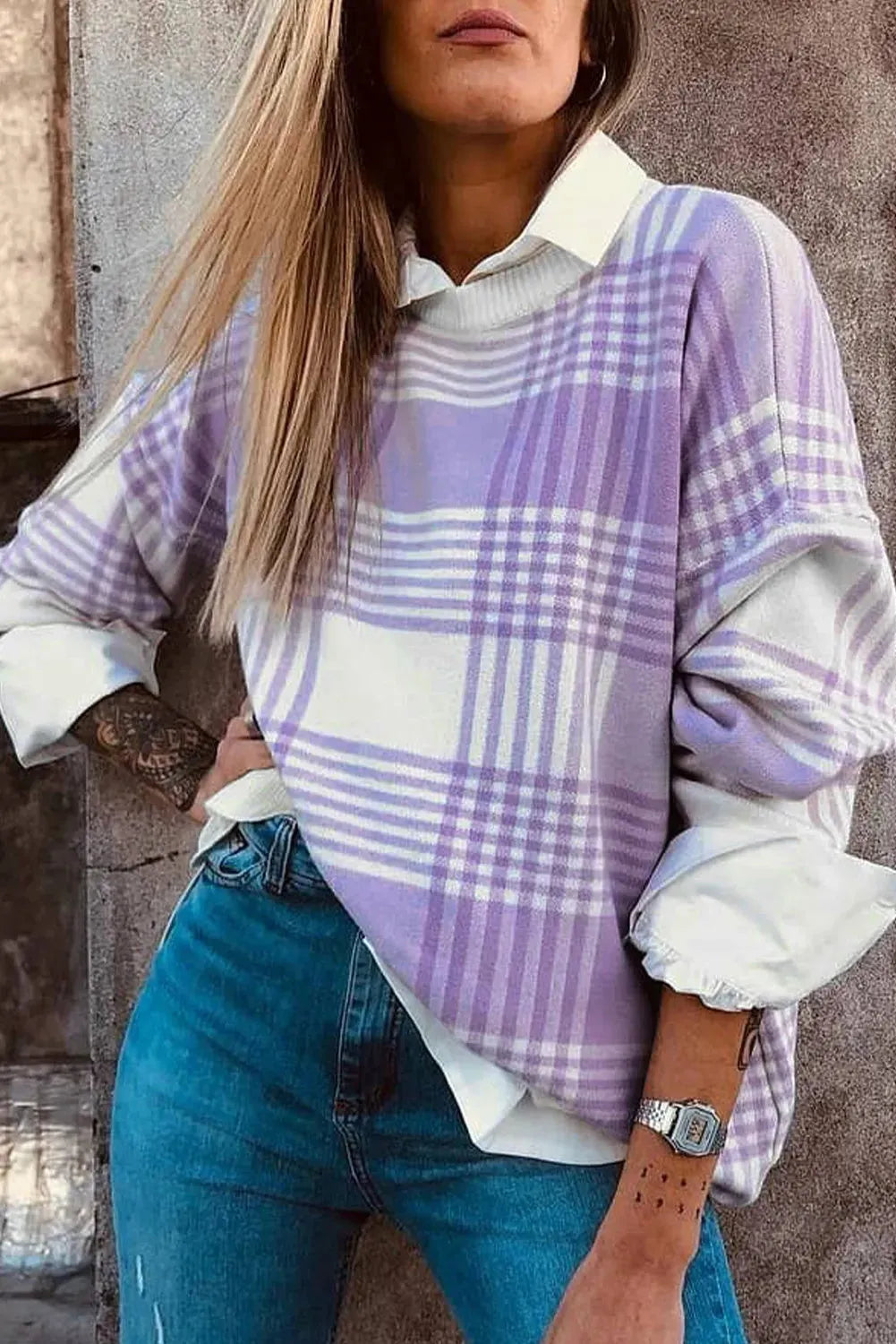 Lilac plaid print loose sweater with ribbed trim at neckline and cuffs on hanger