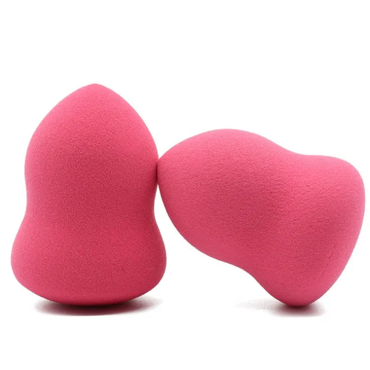 Pink makeup foundation sponge with chiselled edges for blending, shown next to a ruler showing 4cm width.