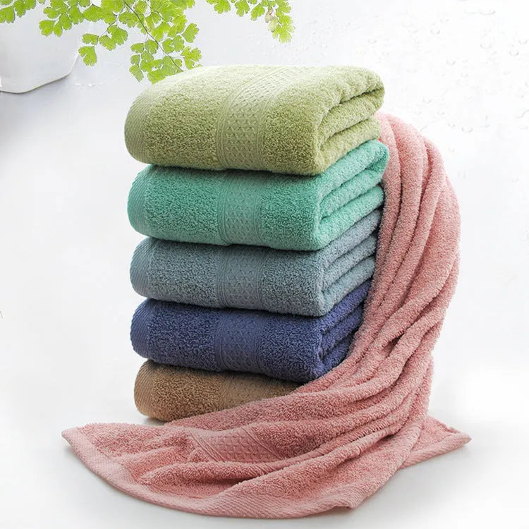 Thickened cotton blend bath and beach towel in solid colour options including green, blue, and pink.