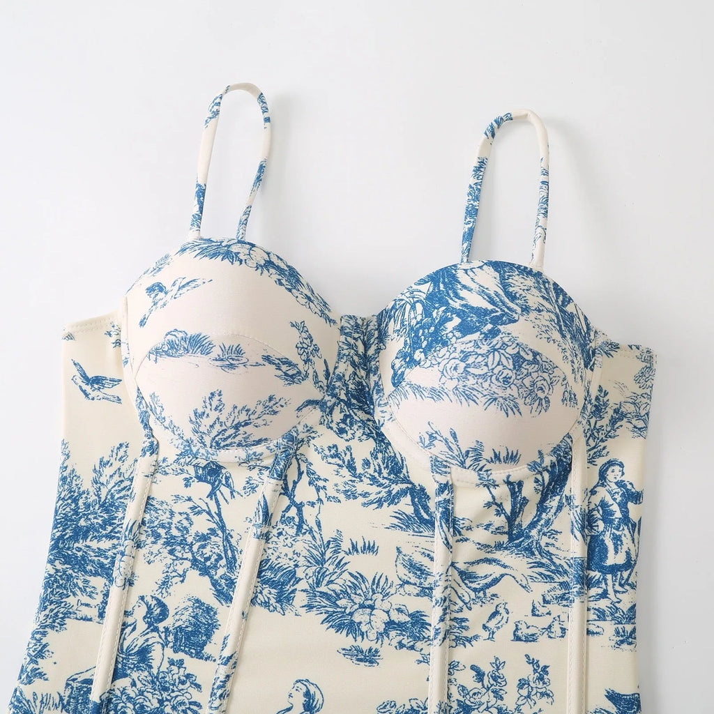 Women's blue one-piece swimsuit with matching gauze skirt set shown front and back