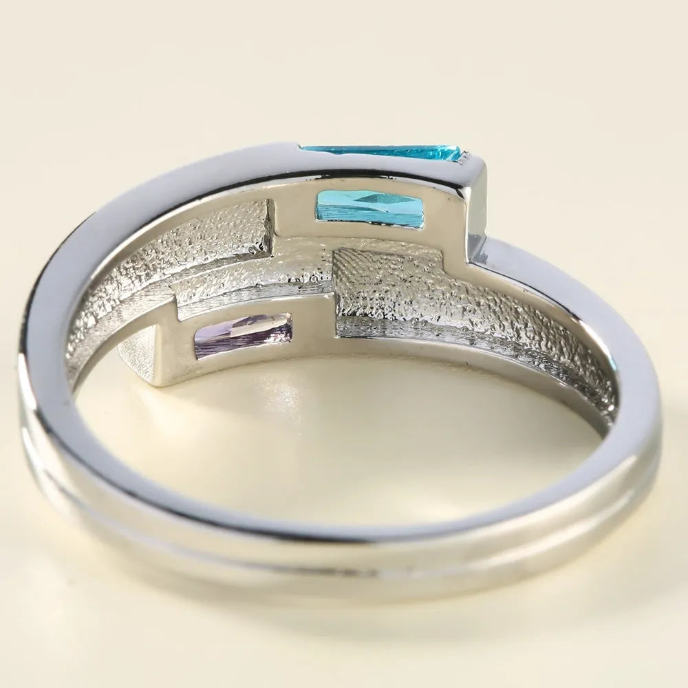 Copper zircon ring with electroplated silver finish showing stone inlays and metallic band