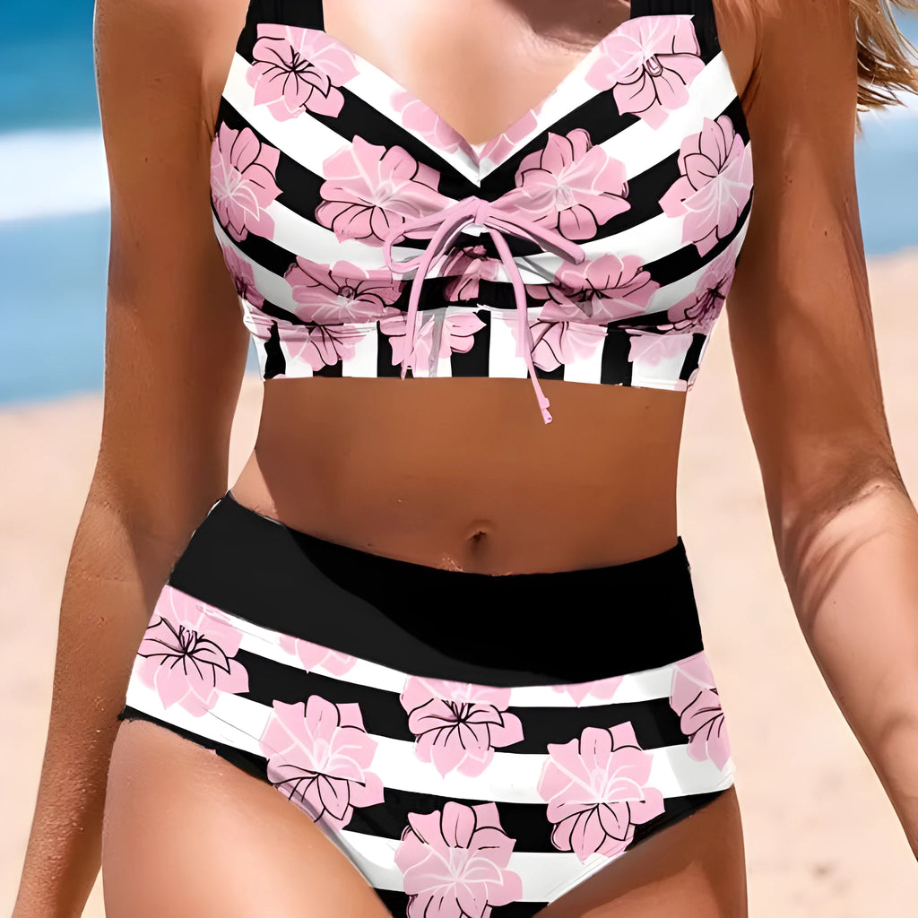 Black women's printed bikini with belly cover and split-leg design for swimming.