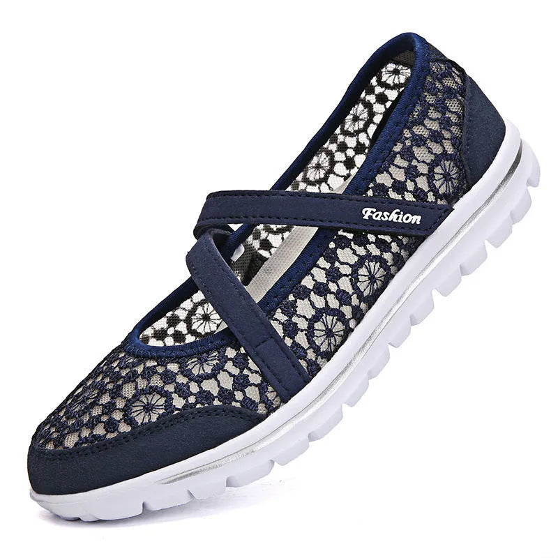 Women's casual flat shoe with breathable mesh upper in beige colour, showing round toe and flat heel design.